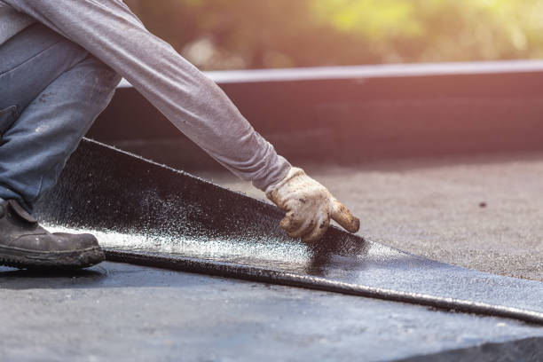 Professional Basement Waterproofing technician working in Garden City, NY
